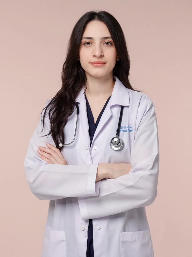 Dr. Hajra Bajwa in a white coat